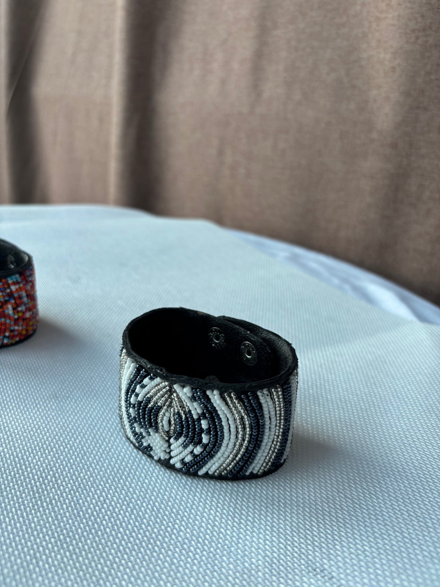 Hand-beaded black white and silver cuff bracelet detail