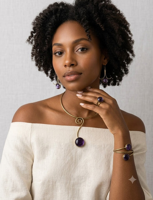 Desert Amber Set worn by model — spiral collar necklace, cuff bracelet, ring and drop earrings in brass and amethyst