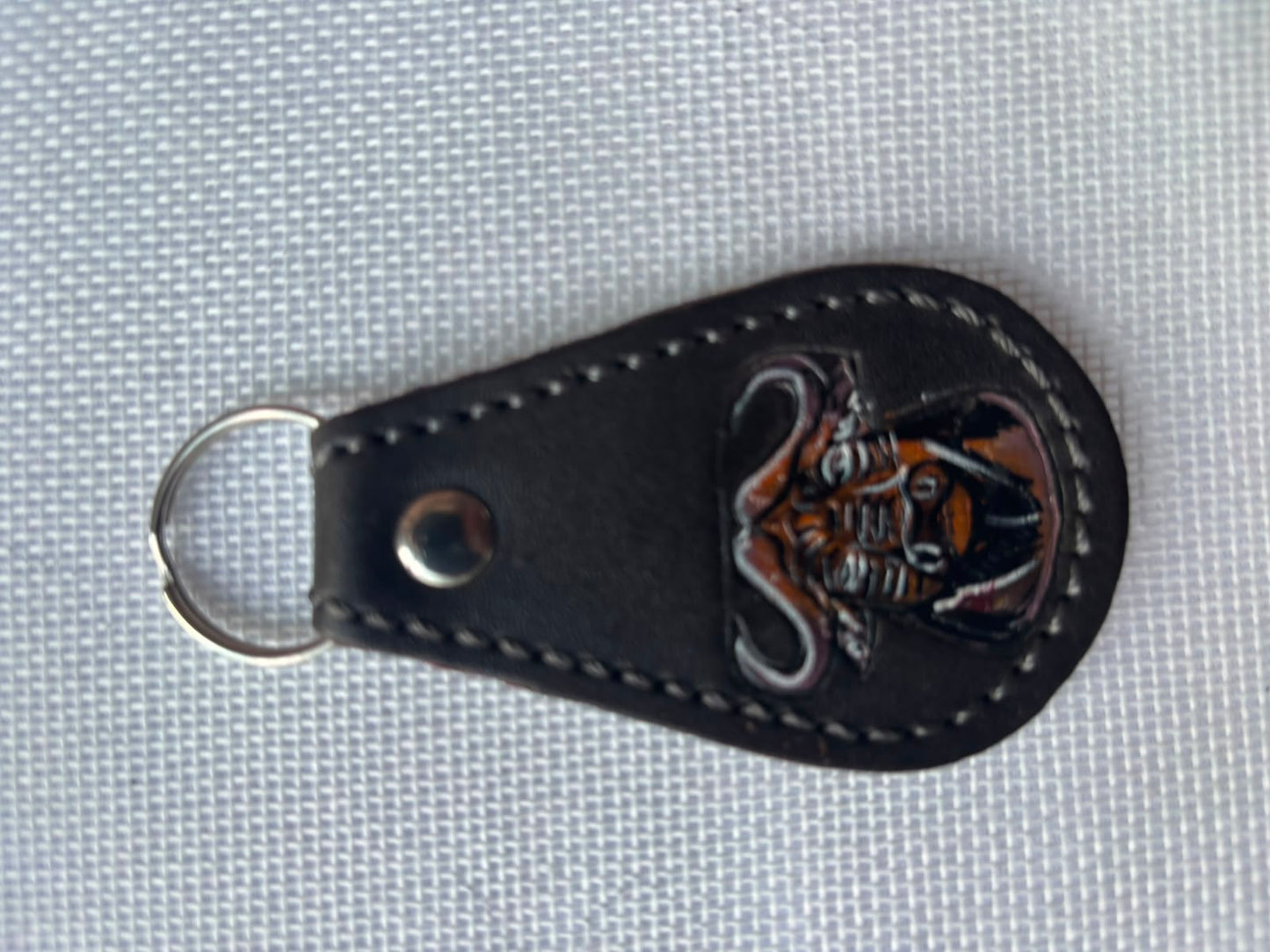 Buffalo Soldier Keychain — black leather teardrop with embossed buffalo soldier emblem