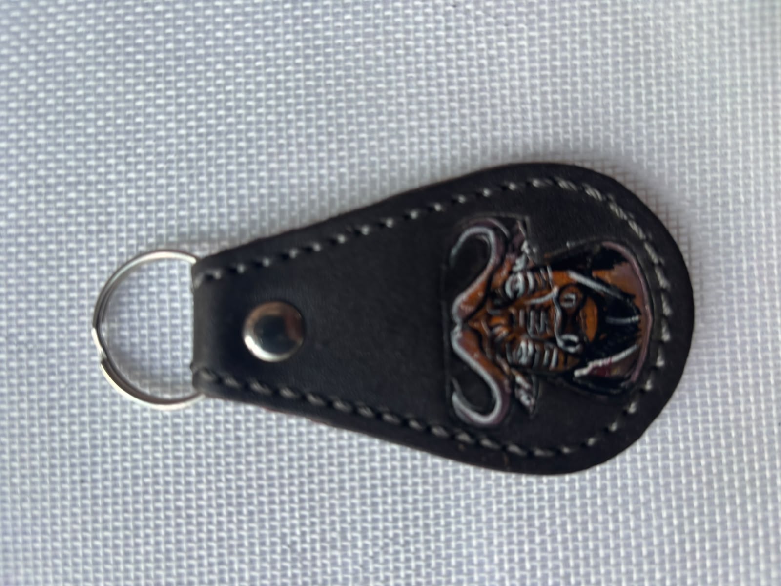 Buffalo Soldier Keychain — black leather teardrop with embossed buffalo soldier emblem
