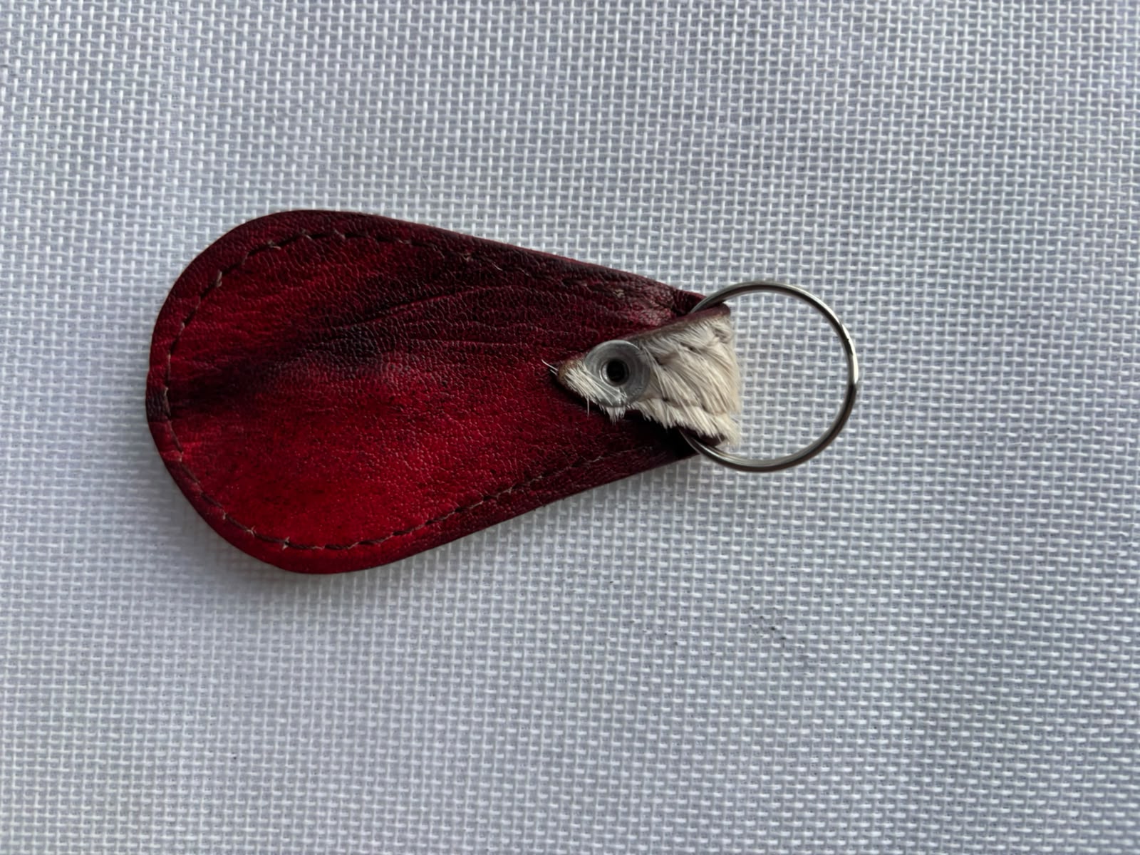 Carved Keychain Style 1 — grey white fur leather keychain with cowrie shell