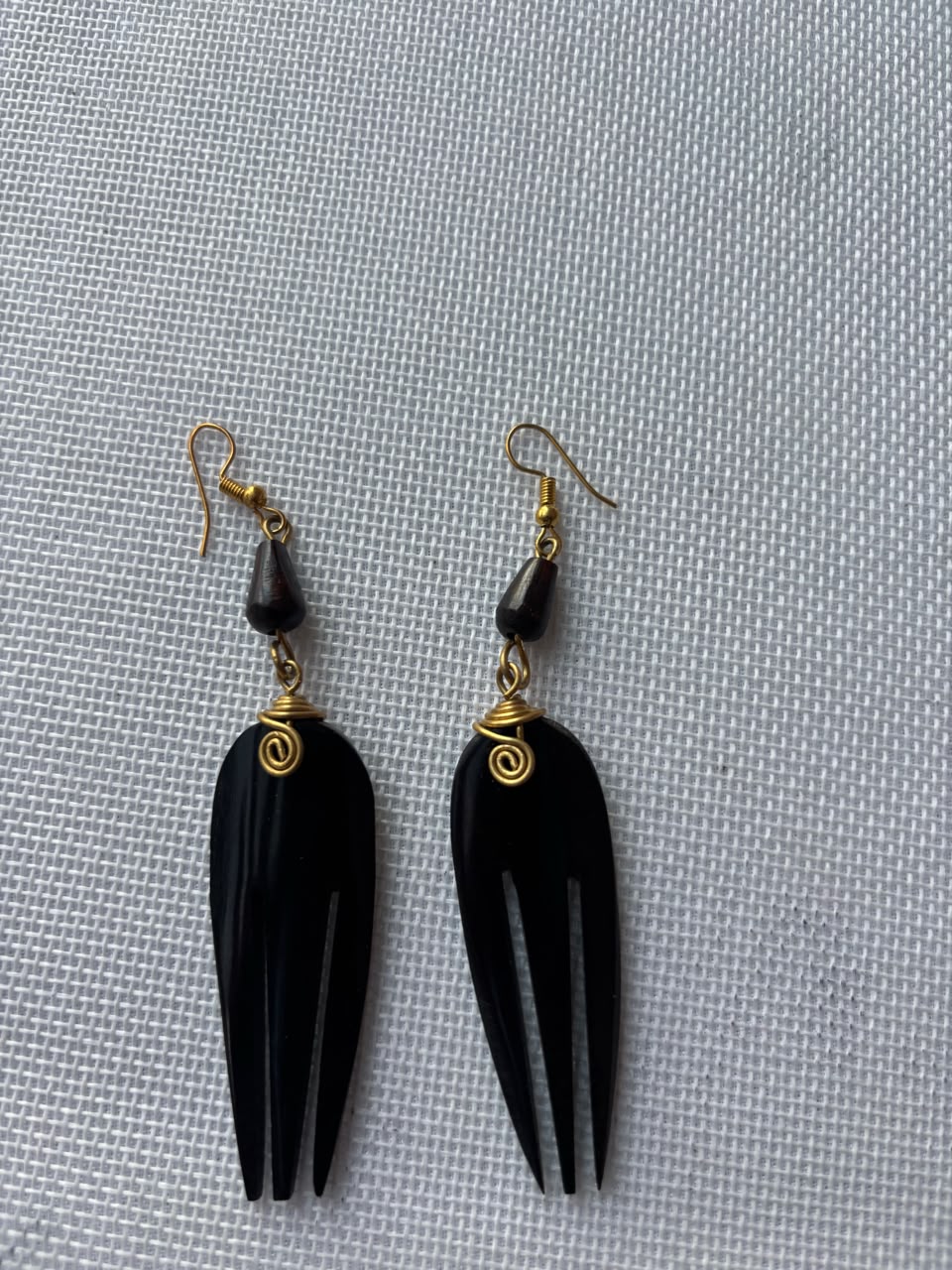 Black Carved Bone Comb Drop Earrings — gold wire spiral