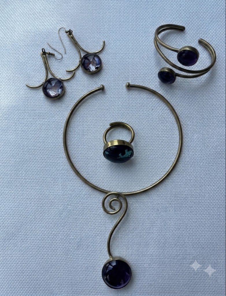 Desert Amber Set flat lay — four-piece brass and amethyst jewelry set