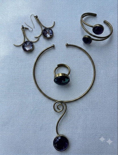 Desert Amber Set flat lay — four-piece brass and amethyst jewelry set
