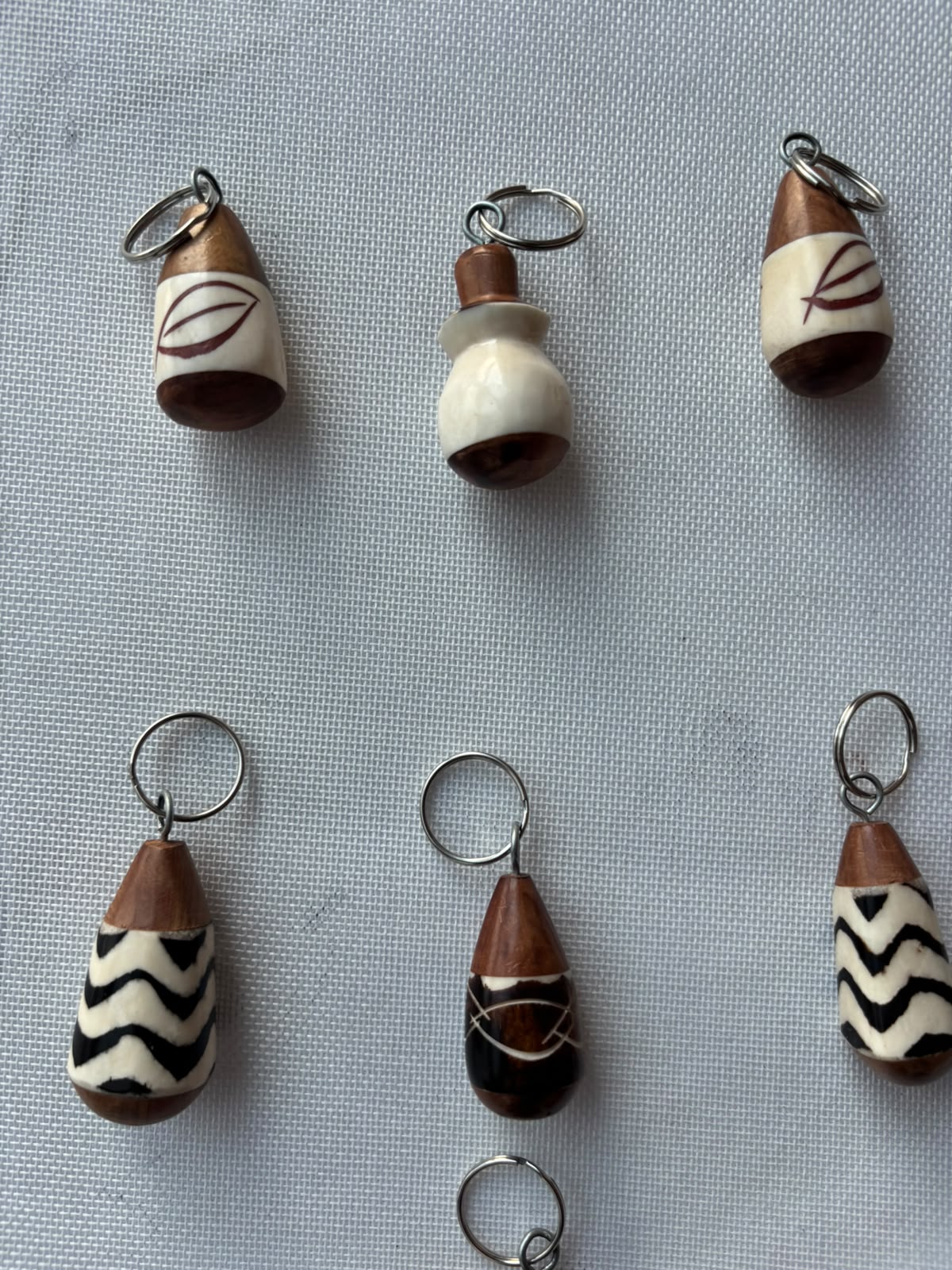 Calabash Carved Keychain — assorted designs including leaf and chevron motifs