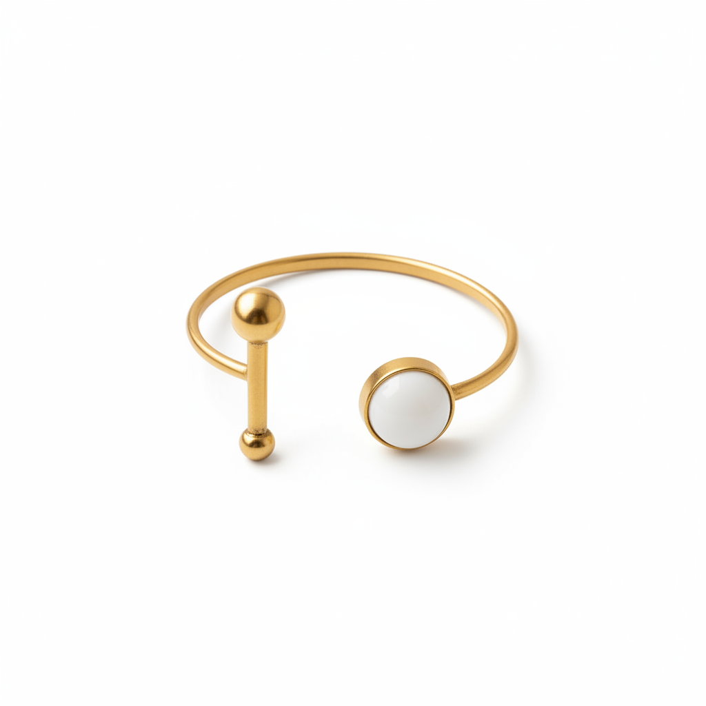 The Lumière Set — gold cuff bracelet with white stone accent, product shot