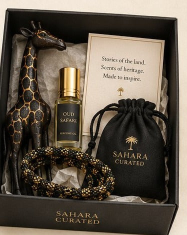SAHARA Safari & Oud Box — carved giraffe, Oud Safari perfume oil, beaded bracelet, and keepsake pouch