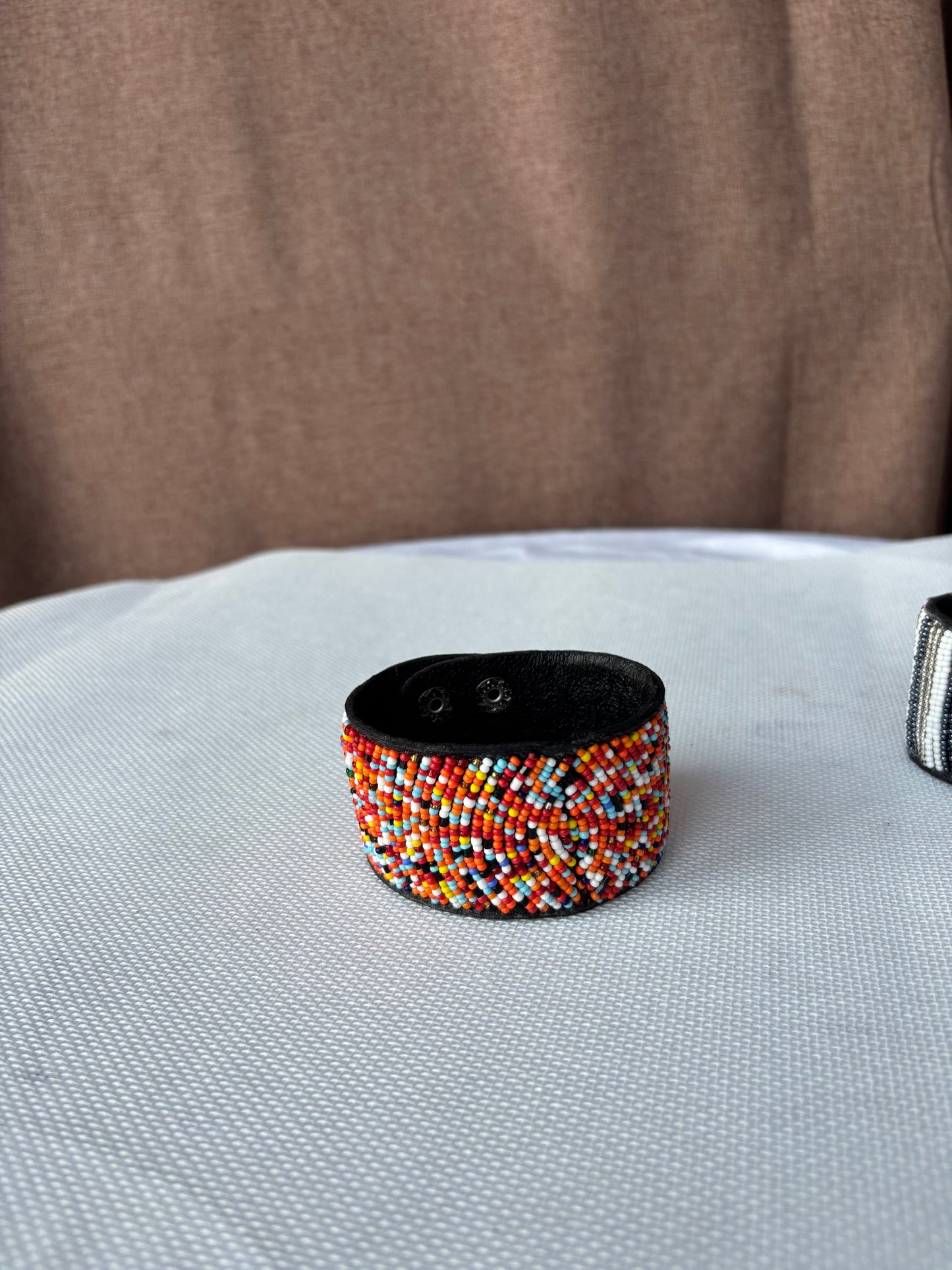 Hand-beaded multicolour cuff bracelet detail