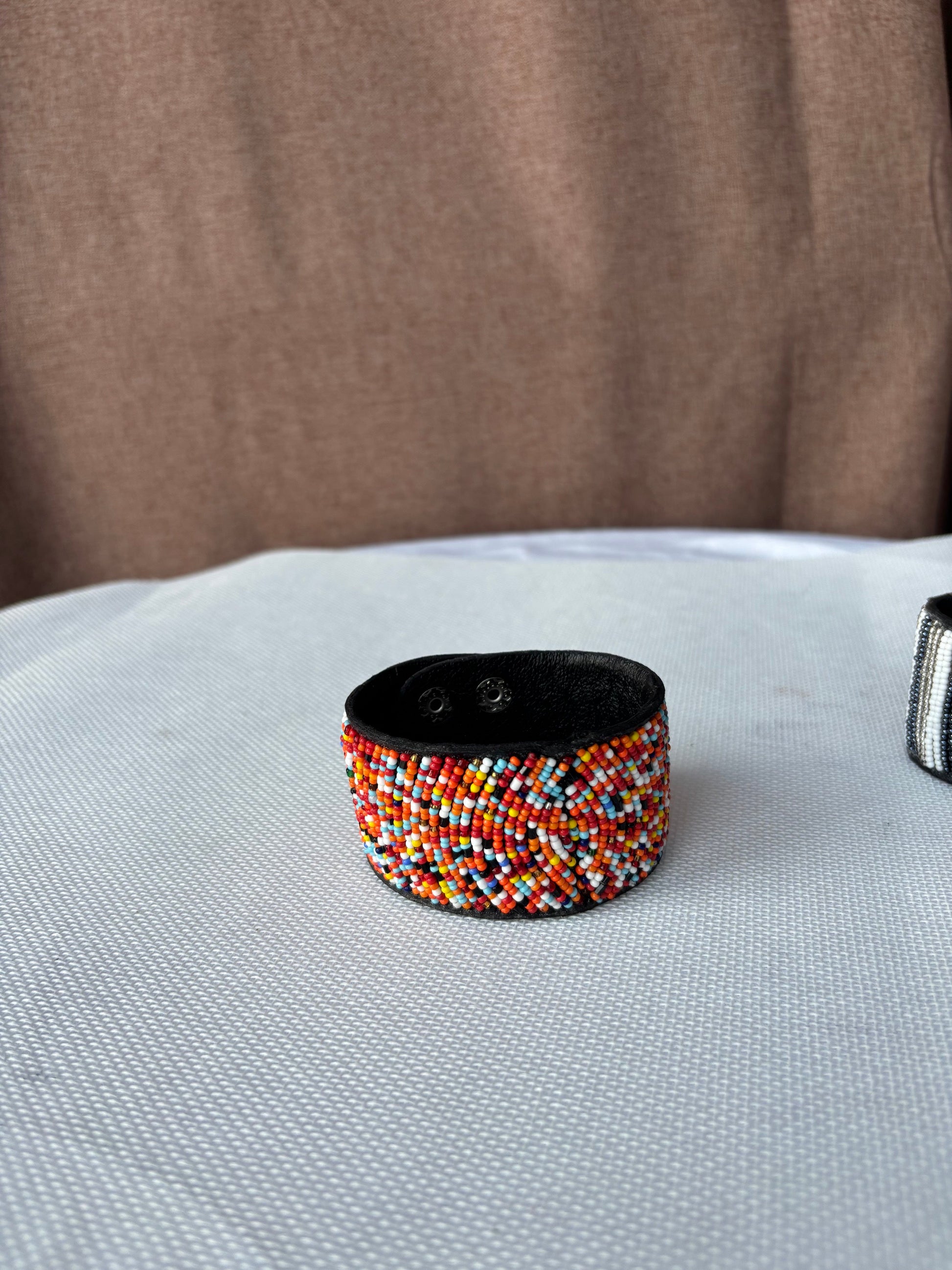 Hand-beaded multicolour cuff bracelet detail
