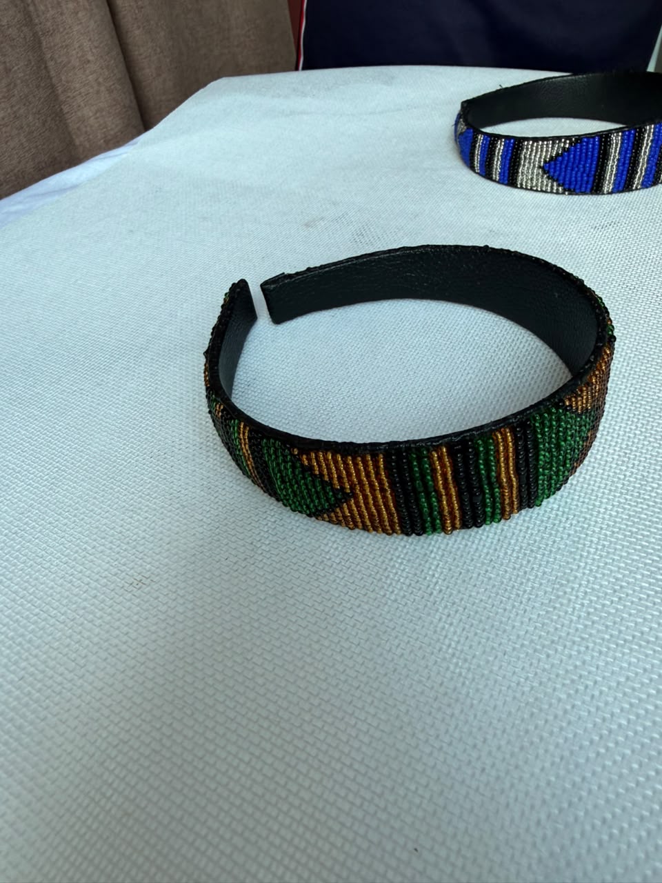 Emerald green and bronze hand-beaded headband front