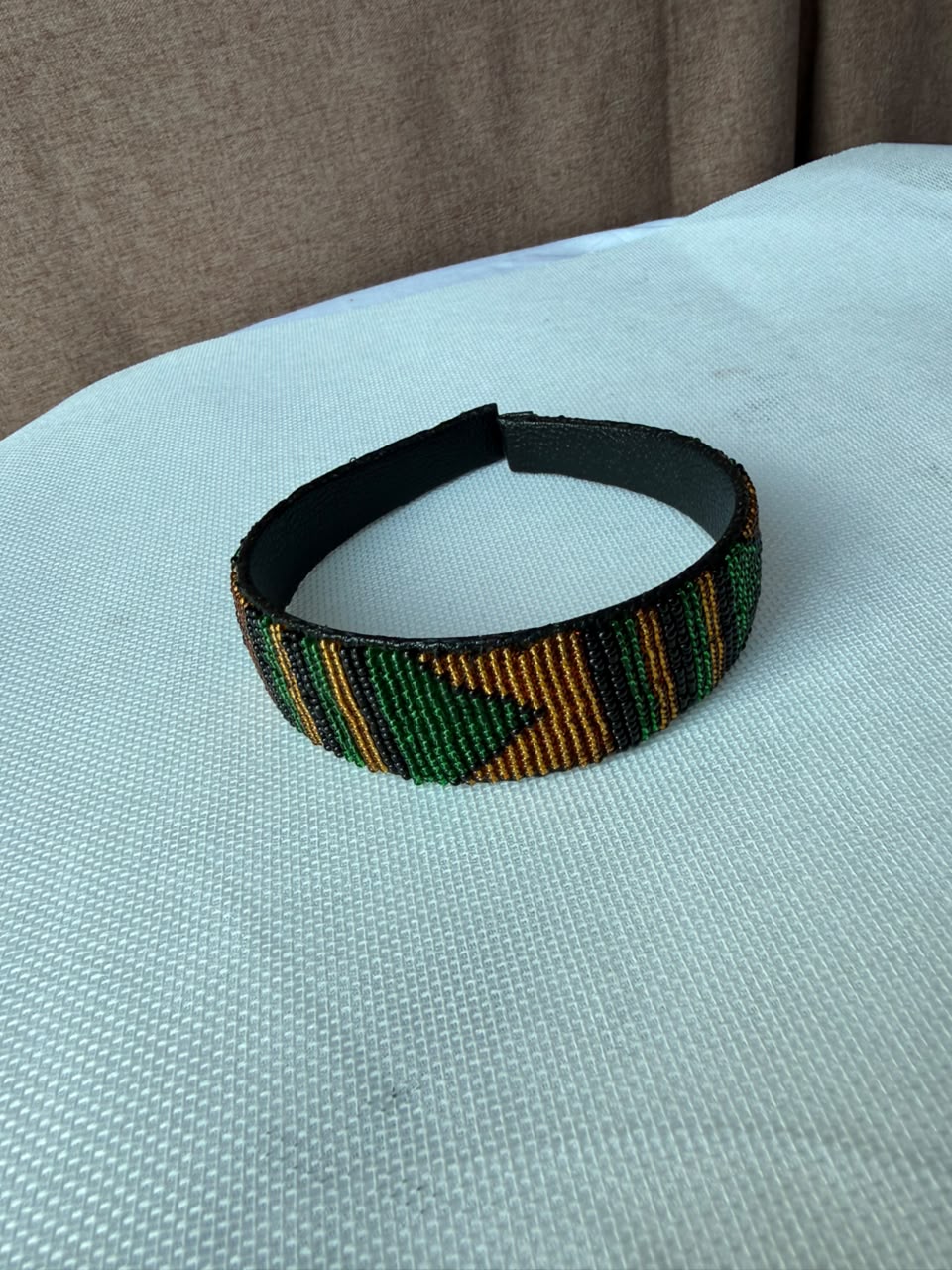 Emerald green and bronze hand-beaded headband close view