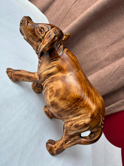 Hand-carved wooden buffalo sculpture overhead detail