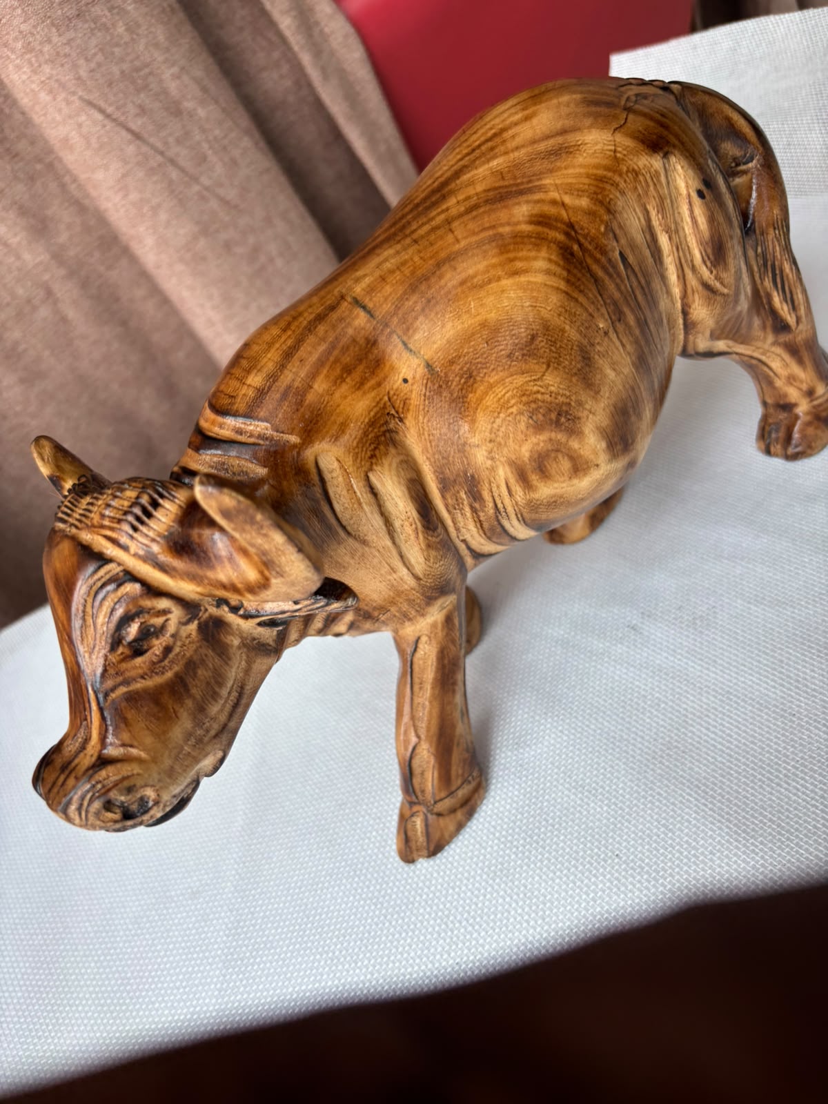 Hand-carved wooden buffalo sculpture second side