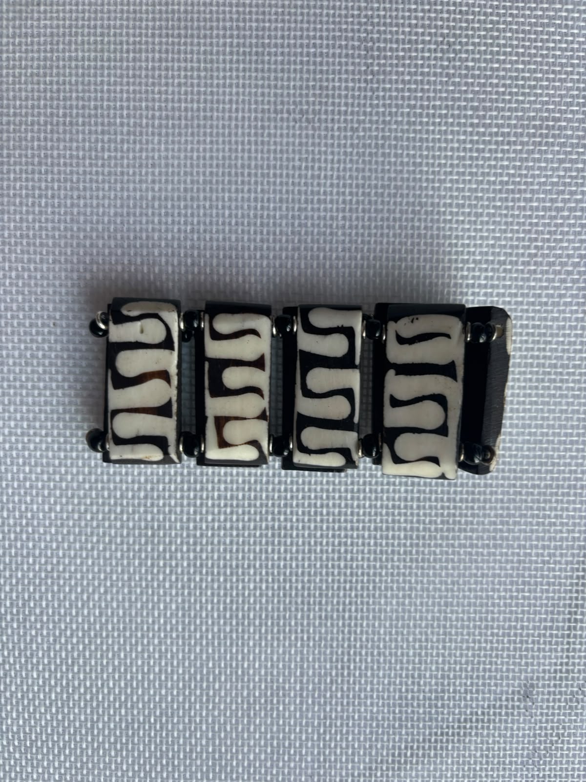 Rhythm Path carved bone bracelet front