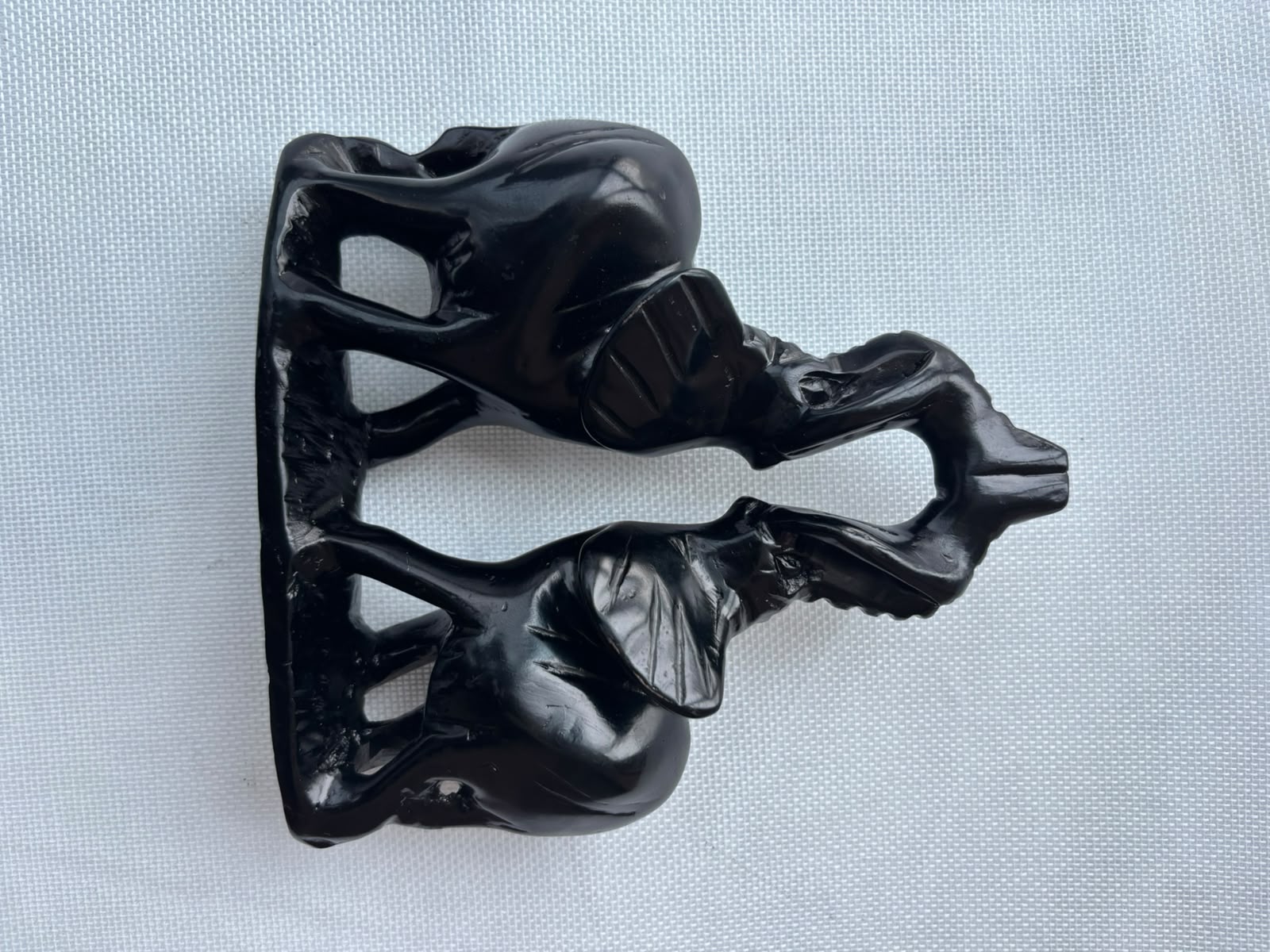 Black elephant pair sculpture profile