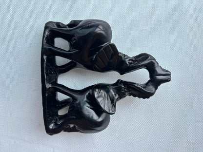 Black elephant pair sculpture profile