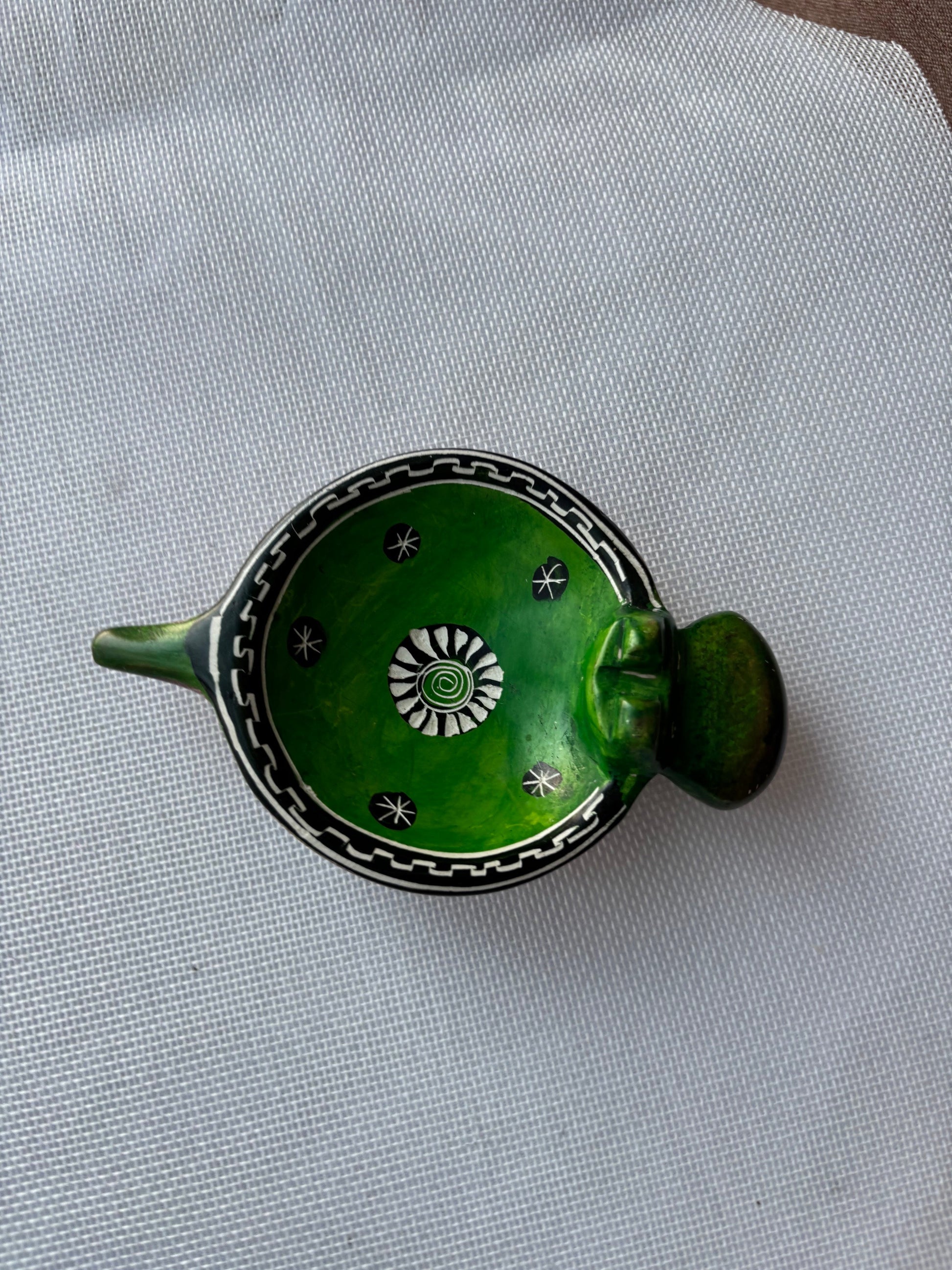 Green hand-painted safari ashtray overhead view
