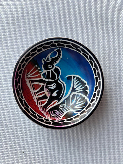 Blue and red African animal ashtray top view