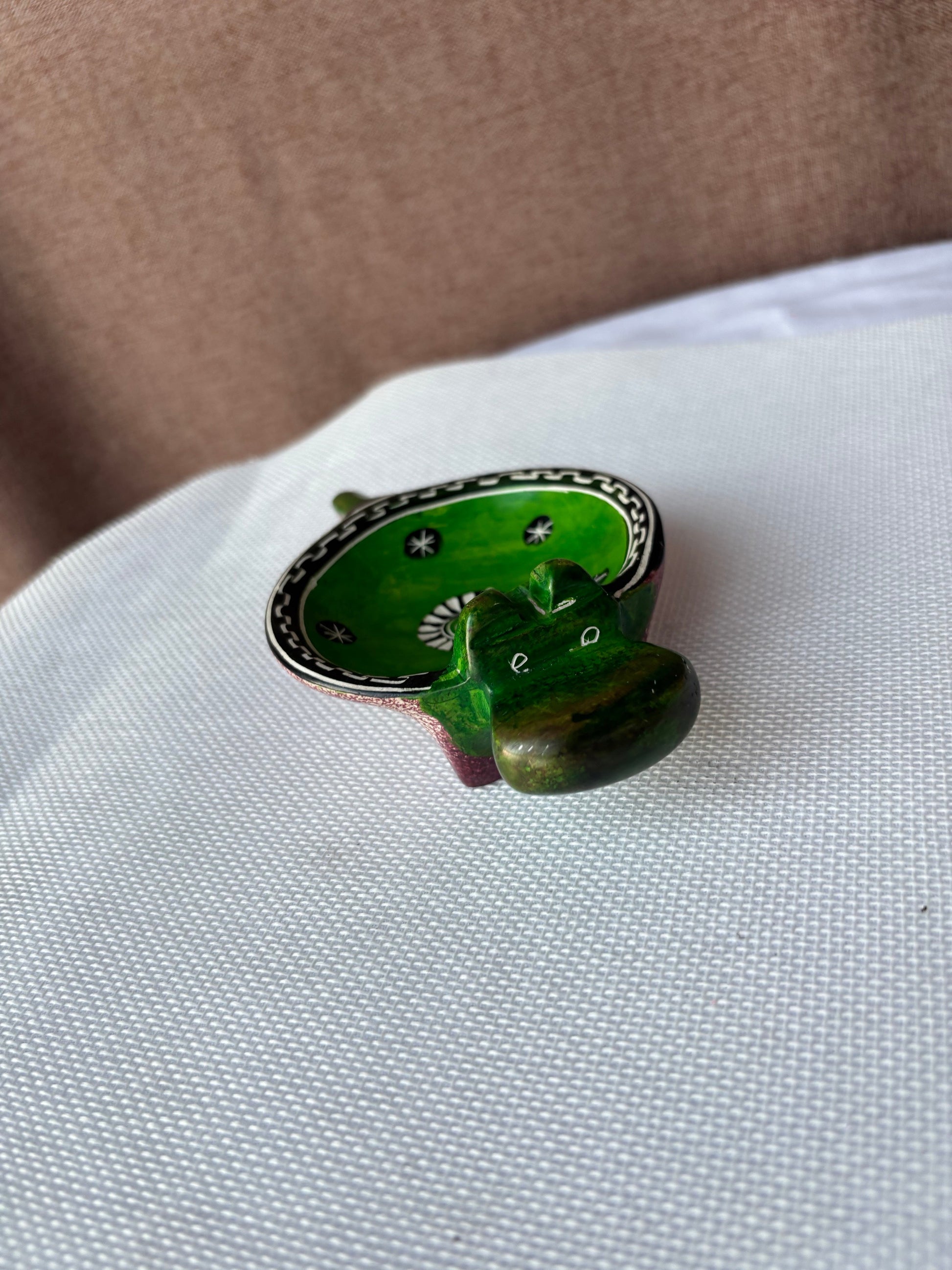 Green hand-painted safari ashtray lifestyle view