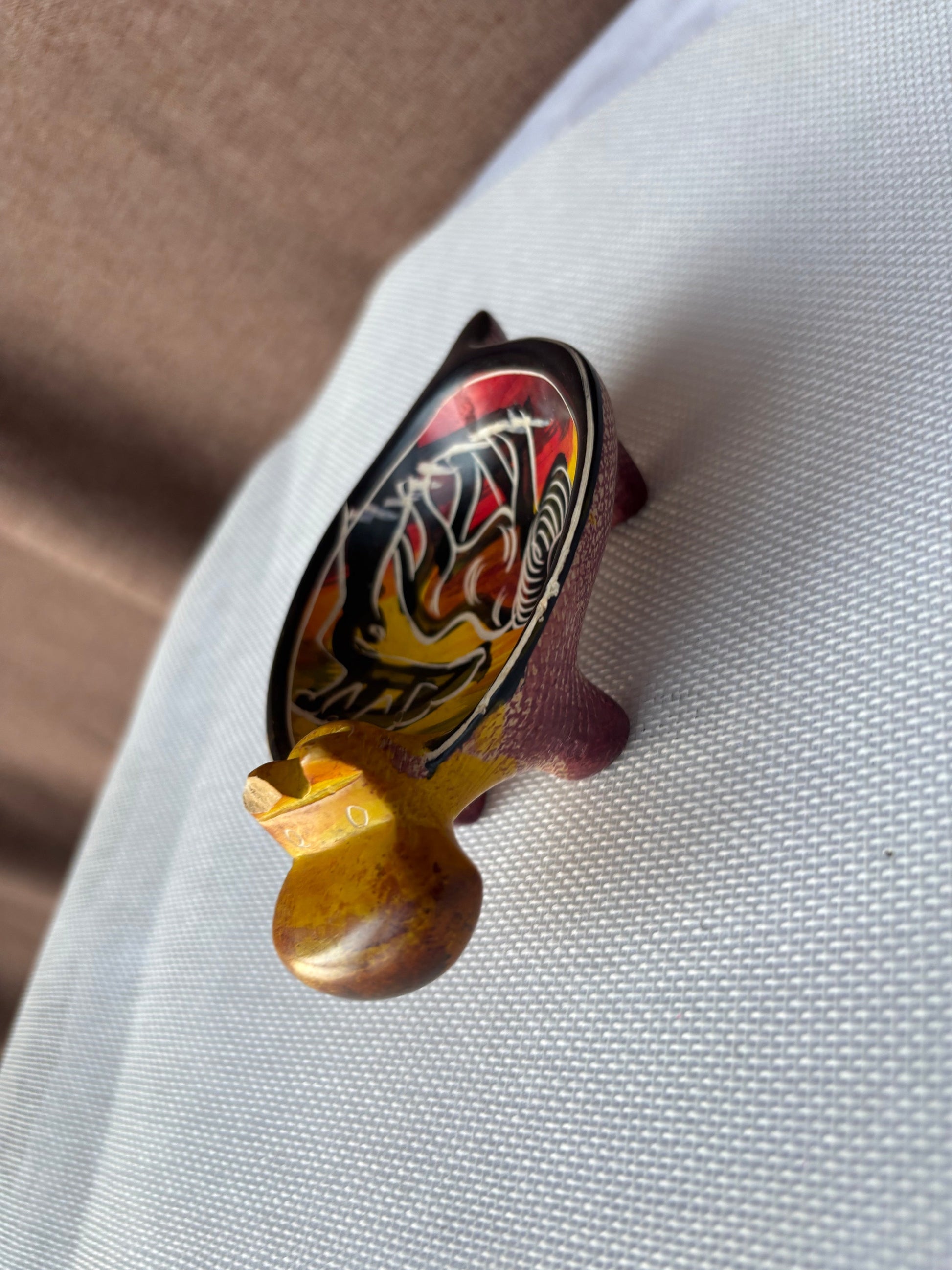 Ochre and red hand-painted safari ashtray side view