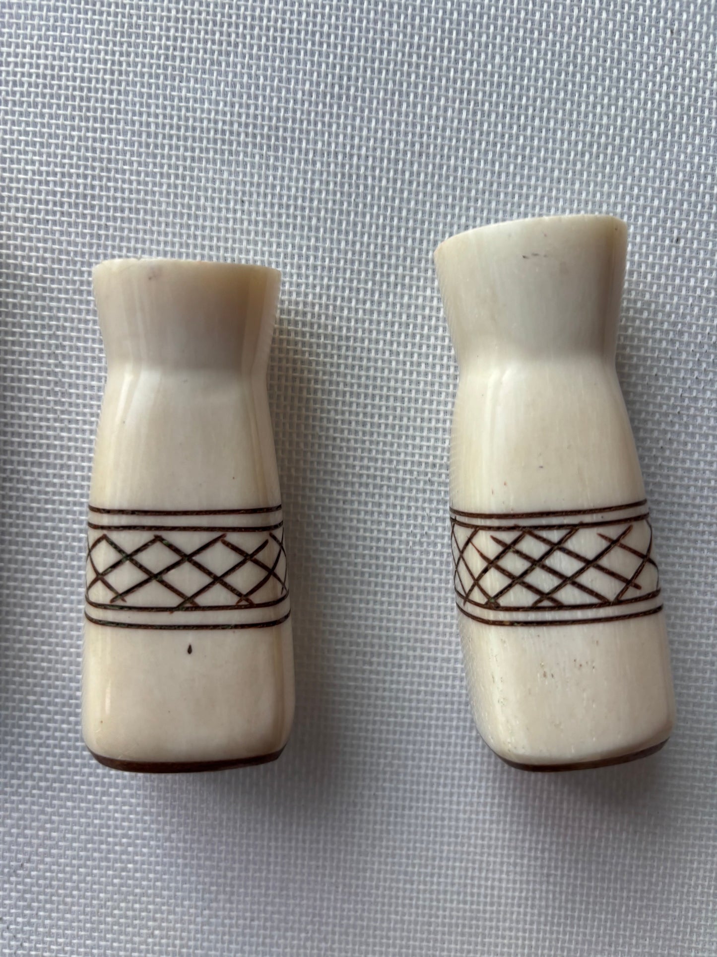 Carved ivory-tone salt and pepper set pair