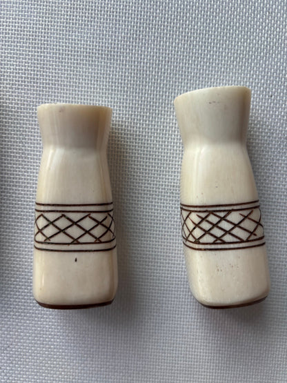 Carved ivory-tone salt and pepper set pair