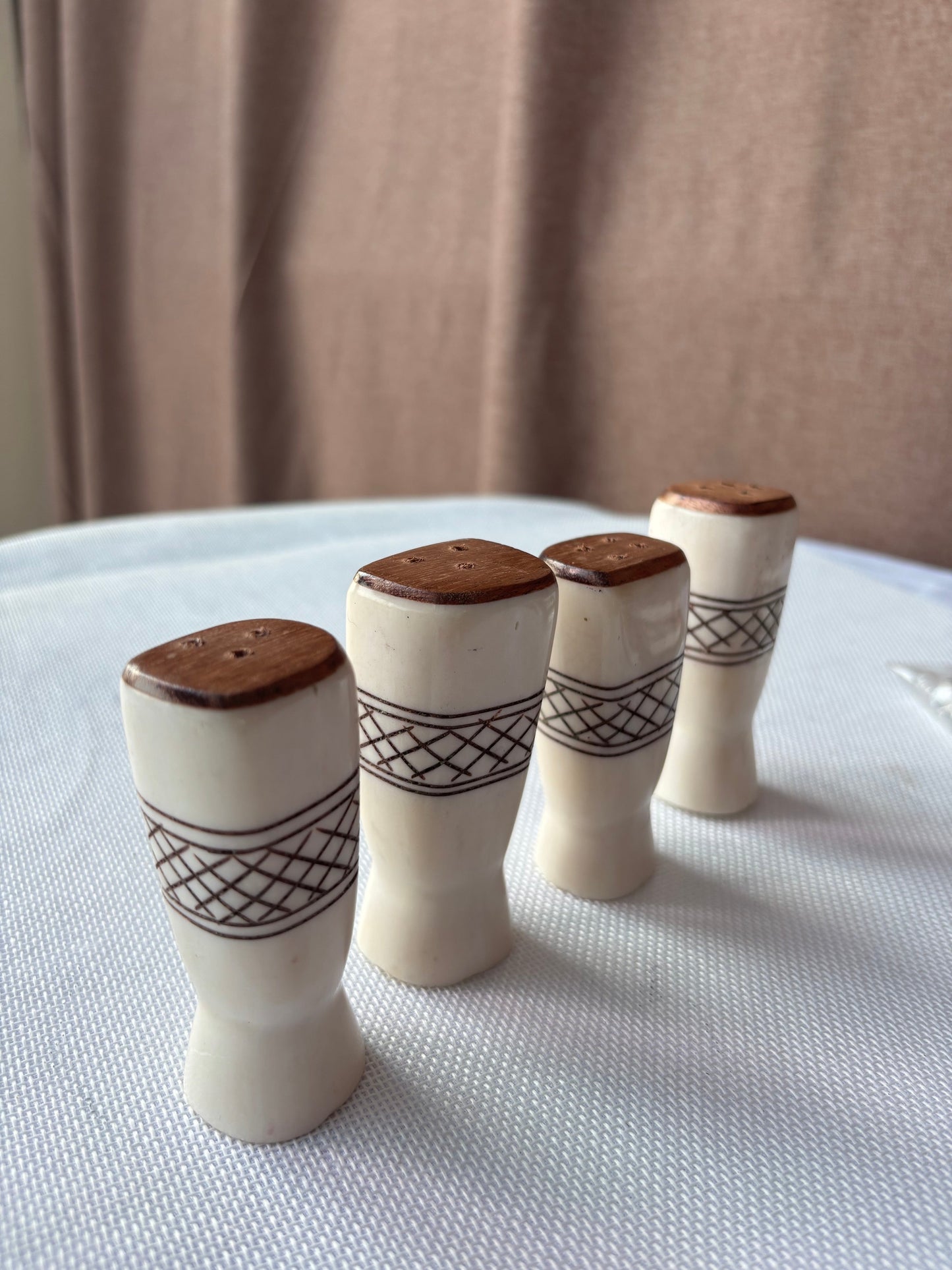 Carved ivory-tone salt and pepper set lifestyle image