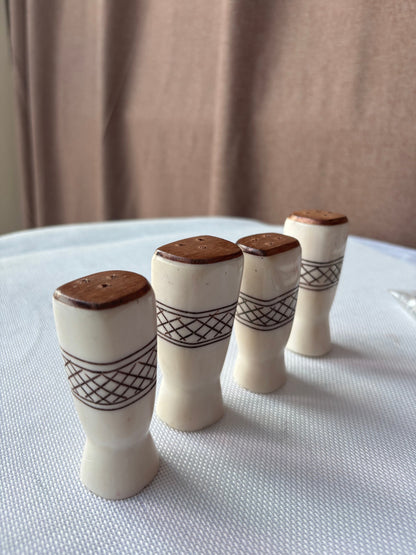 Carved ivory-tone salt and pepper set lifestyle image