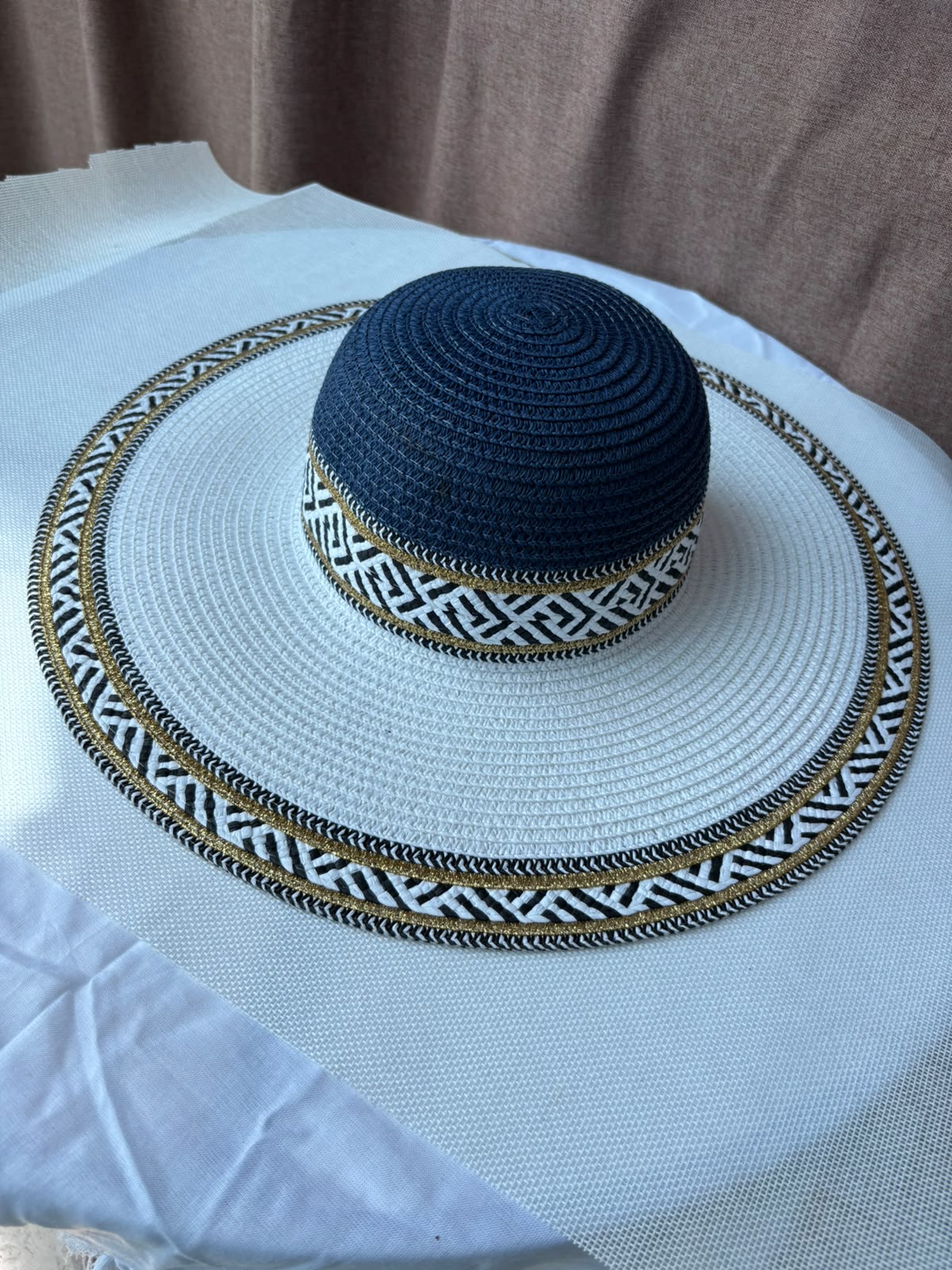 Navy Sahara woven sun hat angled view