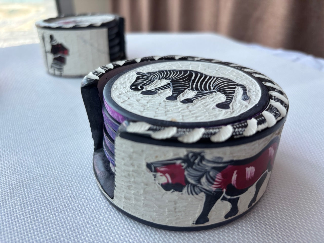 Painted soapstone safari coaster set lifestyle