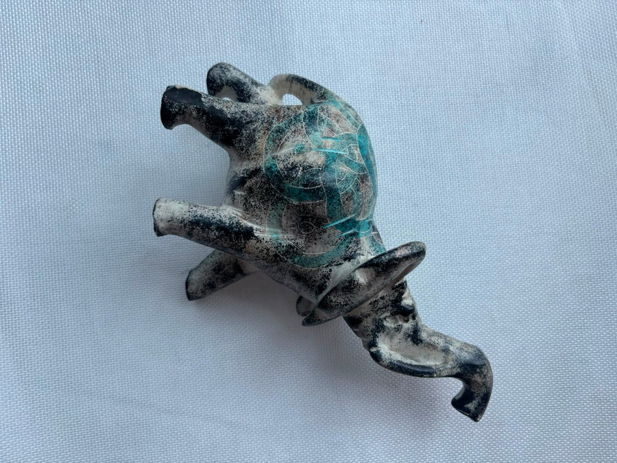 Turquoise patina elephant sculpture angled view